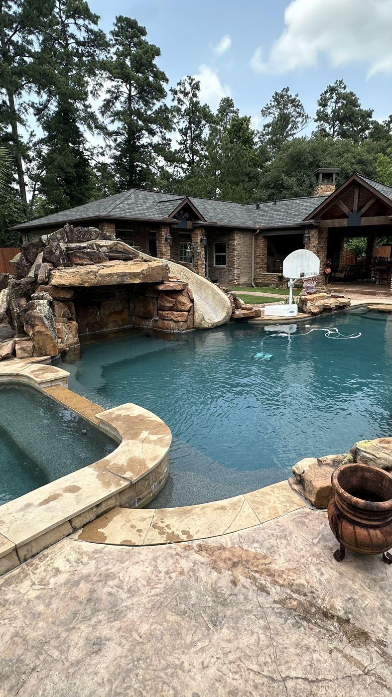 Customer pool with a rock grotto and spa