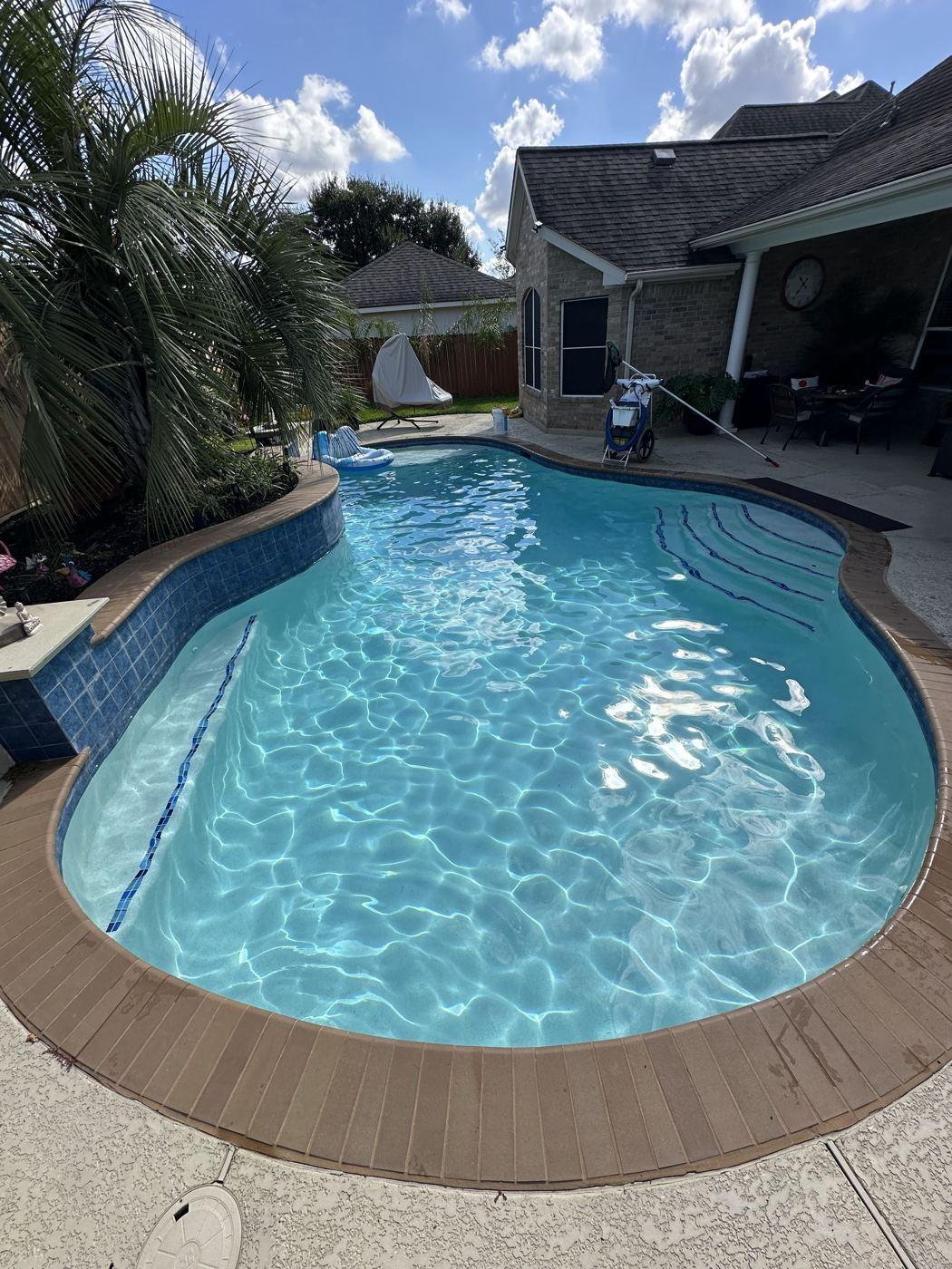 Curved customer pool on a sunny day